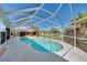 A screened in pool is the perfect place to relax at 1815 Killdeer Ct, Venice, FL 34293