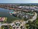 Community clubhouse with pool and tennis courts as seen from above. Townhouses can be seen in the background at 232 Teramo Way, Nokomis, FL 34275