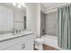 This bathroom features a white vanity with marble top, toilet, and shower/tub combo at 232 Teramo Way, Nokomis, FL 34275