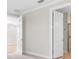 Neutral bedroom features a large door into the bathroom with a walk in shower at 232 Teramo Way, Nokomis, FL 34275