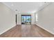 Bright living room with sliding glass doors leading to a view of the backyard at 232 Teramo Way, Nokomis, FL 34275