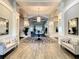 Elegant lobby with neutral colors, decorative lighting, and seating areas at 560 Fallbrook Dr, Venice, FL 34292