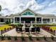 Charming outdoor patio with a cozy fire pit and comfortable seating, perfect for gatherings at 560 Fallbrook Dr, Venice, FL 34292