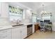 Well-lit kitchen and adjacent workspace, featuring white cabinetry at 5800 Sabal Trace Dr # 501, North Port, FL 34287