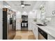 Modern kitchen featuring white cabinets and stainless steel appliances at 5800 Sabal Trace Dr # 501, North Port, FL 34287