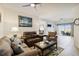 Inviting living room with tile floors, ceiling fan, and comfortable seating at 5800 Sabal Trace Dr # 501, North Port, FL 34287