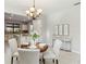 Inviting dining space with a charming round table, seamlessly connected to the updated kitchen area at 13864 Posada St, Venice, FL 34293