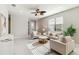 Comfortable living room featuring ample sunlight, neutral furniture, and stylish decor creating a serene space at 13864 Posada St, Venice, FL 34293
