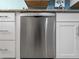 A stainless steel Bosch dishwasher is framed by white kitchen cabinetry and granite countertops at 1423 Avenida Del Circo # 1C, Venice, FL 34285