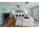 Cozy living room featuring a plush white sofa with decorative pillows, complemented by stylish decor and warm lighting at 1423 Avenida Del Circo # 1C, Venice, FL 34285