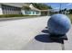 Bocce ball on a well-maintained court with a view of the clubhouse and clear blue skies at 256 Royal Oak Way, Venice, FL 34292
