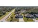 Aerial view of the home showcasing its location, landscaping, and surrounding neighborhood with mature trees at 2949 Jaylene Rd, North Port, FL 34288