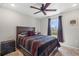 Bedroom featuring a ceiling fan, window with curtains, and bedside table at 2949 Jaylene Rd, North Port, FL 34288