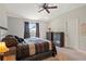 Inviting bedroom with a ceiling fan, a large window with natural light, and two wooden dressers at 2949 Jaylene Rd, North Port, FL 34288