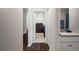Hallway featuring a bathroom and bedroom with neutral paint and wood flooring at 2949 Jaylene Rd, North Port, FL 34288