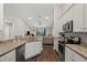 Modern kitchen featuring granite countertops, stainless steel appliances, and wood flooring at 2949 Jaylene Rd, North Port, FL 34288