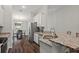 Bright kitchen with a stainless steel sink, granite countertops, and view of the dining area at 2949 Jaylene Rd, North Port, FL 34288