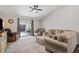 Bright living room with a ceiling fan and sliding glass doors leading to the patio at 2949 Jaylene Rd, North Port, FL 34288