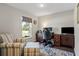Home office features wood desk and furniture with a large window and view to the yard at 2949 Jaylene Rd, North Port, FL 34288