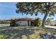 Charming single-story home with a mature tree in the front yard at 3187 Galiot Rd, Venice, FL 34293