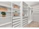 A large walk-in closet with custom shelving, drawers, and ample storage space at 400 Maraviya Blvd, Nokomis, FL 34275