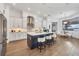 Modern kitchen features a large island, stainless steel appliances, and elegant white cabinetry for a sleek design at 400 Maraviya Blvd, Nokomis, FL 34275