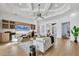 Spacious living room with coffered ceilings, modern decor, and open layout leading to other areas of the home at 400 Maraviya Blvd, Nokomis, FL 34275