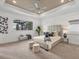 A spacious main bedroom with tray ceiling, recessed lighting, a large window, and stylish accents at 400 Maraviya Blvd, Nokomis, FL 34275