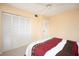 Well-lit bedroom featuring a ceiling fan and closet space at 408 Cerromar S Cir # 132, Venice, FL 34293