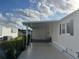 Covered carport providing ample parking space and protection from the elements at 863 Baveno Dr, Venice, FL 34285