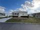 Well-maintained single-story home with manicured lawn and easy street access at 863 Baveno Dr, Venice, FL 34285