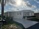 Charming single-story home featuring a covered carport and well-maintained landscaping for enhanced curb appeal at 863 Baveno Dr, Venice, FL 34285