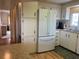 Functional kitchen featuring modern appliances, ample cabinet space, and an adjacent dining area at 863 Baveno Dr, Venice, FL 34285