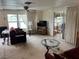 Cozy living room featuring large windows with water views, comfortable seating, and ample natural light at 863 Baveno Dr, Venice, FL 34285