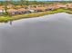 Beautiful homes overlook a serene lake in this lovely community with lush lawns and tile roofs at 9895 Wingood Dr, Venice, FL 34292
