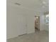 Bright bedroom featuring an ensuite bathroom and neutral tile floors at 9895 Wingood Dr, Venice, FL 34292