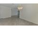 Bright dining room featuring tiled floors, light walls, crown molding, and a beaded chandelier at 9895 Wingood Dr, Venice, FL 34292