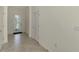 Bright and welcoming foyer with ceramic tile flooring, multiple doorways, and neutral walls ready for personalization at 9895 Wingood Dr, Venice, FL 34292