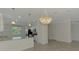Bright kitchen and dining area featuring granite countertops and tiled floors at 9895 Wingood Dr, Venice, FL 34292