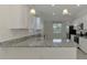 Bright kitchen featuring stainless steel appliances and granite countertops at 9895 Wingood Dr, Venice, FL 34292