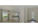 Bright kitchen and dining area featuring granite countertops and tiled floors at 9895 Wingood Dr, Venice, FL 34292