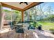 Charming screened-in patio with tile flooring and comfortable seating, perfect for relaxation at 107 Corte Del Rosa, Venice, FL 34285