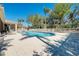 Community pool area with lounge chairs and well-maintained landscaping at 107 Corte Del Rosa, Venice, FL 34285