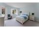 Serene bedroom featuring a queen-size bed, neutral colors, and ample natural light at 11053 Barnsley Dr, Venice, FL 34293
