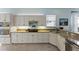 Bright kitchen featuring granite counters, stainless appliances, and classic white cabinetry at 11053 Barnsley Dr, Venice, FL 34293