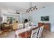 Open-concept living room with a formal dining area at 11053 Barnsley Dr, Venice, FL 34293