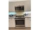 Bright kitchen with stainless steel appliances and stone countertops at 1655 Lancashire Dr # 1655, Venice, FL 34293