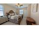 Spacious main bedroom with a beautiful bed frame and comfortable furnishings, creating a serene retreat at 19716 Fishhawk Trl, Venice, FL 34293