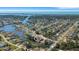 Expansive aerial view of a waterfront community with lush landscaping and a serene coastal backdrop at 1985 Fairview Dr, Englewood, FL 34223