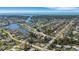 Panoramic aerial view of a waterfront community, showcasing the home's prime location near the water and neighborhood layout at 1985 Fairview Dr, Englewood, FL 34223